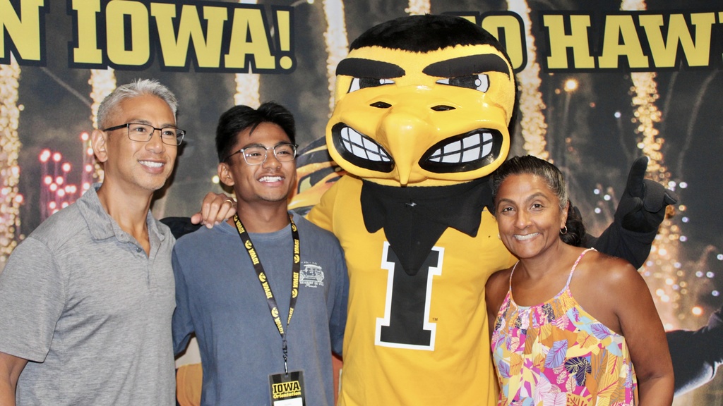 family with herky at becoming a Hawkeye event